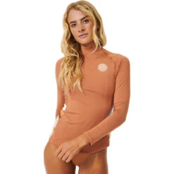 Rip Curl Womens Sunrise Stripe UPF Long Sleeve Rash Guard 11 Rip Curl Womens Sunrise Stripe UPF Long Sleeve Rash Guard -Deep Wetsuit 202320Rip20Curl20Womens20Sunrise20Stripe20UPF20Long20Sleeve20Rash20Guard20152WRV20 20Brown2020front202.2000x2000